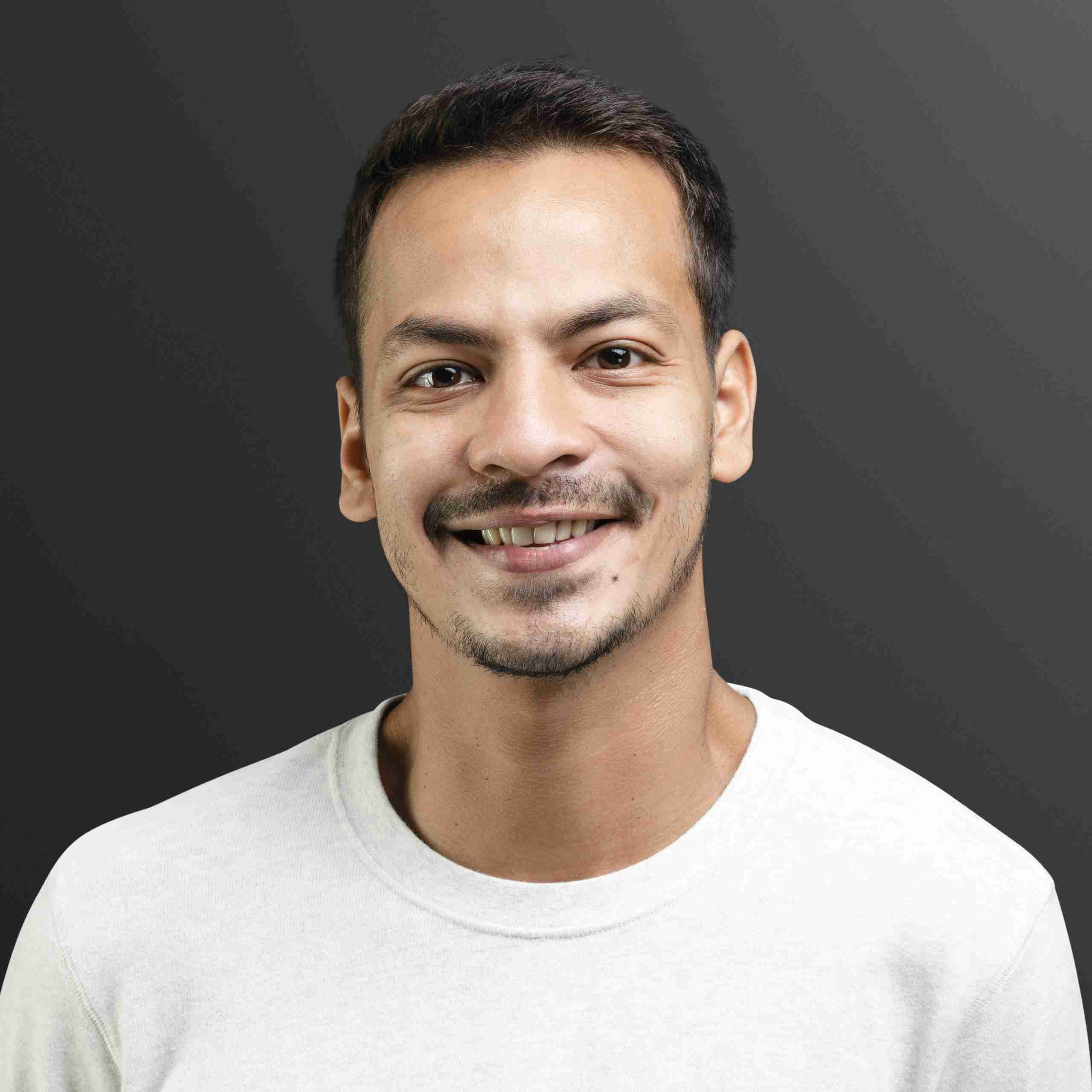 smiling-man-in-white-long-sleeve-tee-portrait